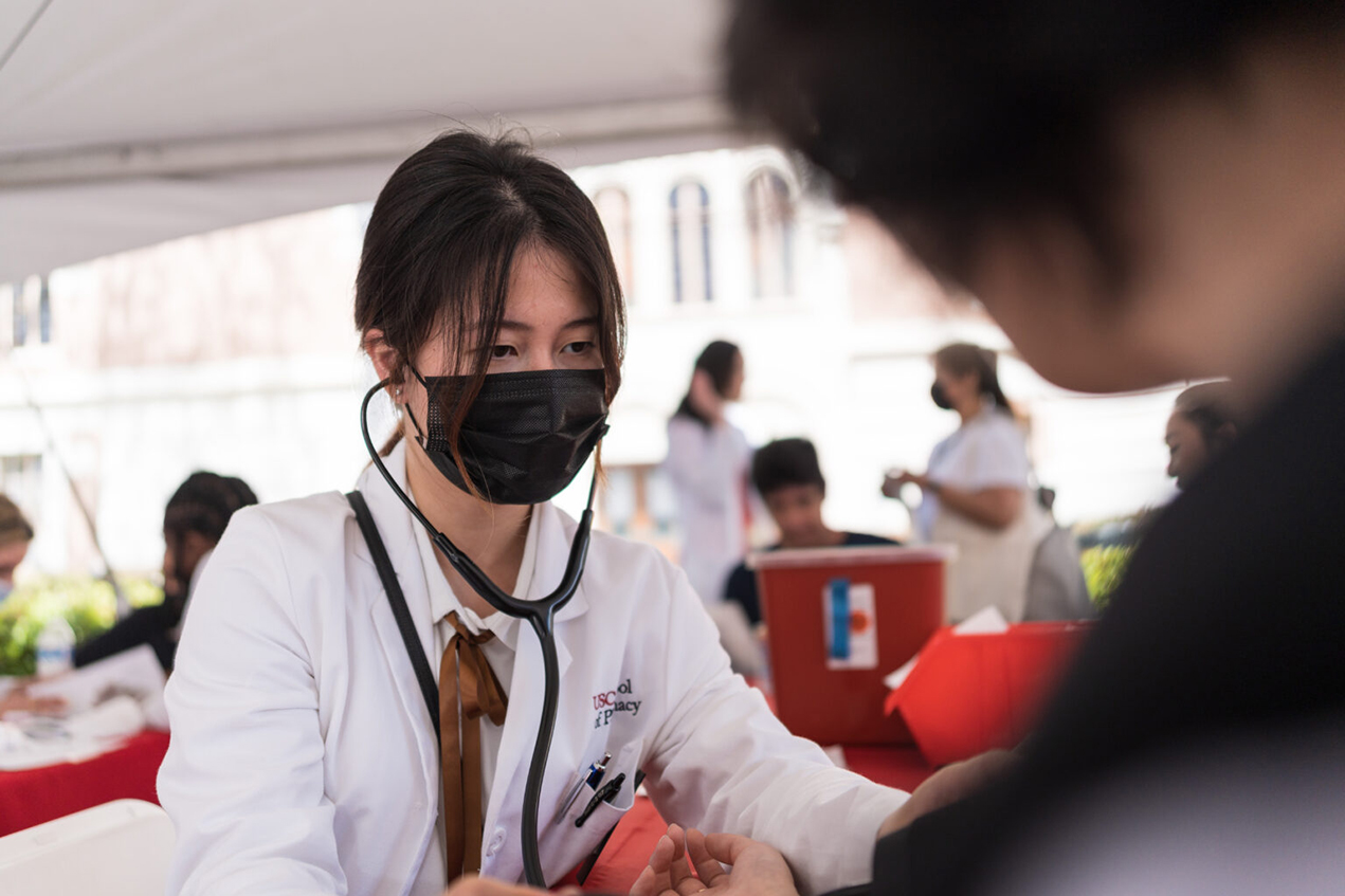 Kerry Zhu, a first-year PharmD student at the USC Alfred E. Mann School of Pharmacy and Pharmaceutical Sciences, was one of 42 students who provided health screening and consultations to health fair participants at the L.A. Times Festival of Books.