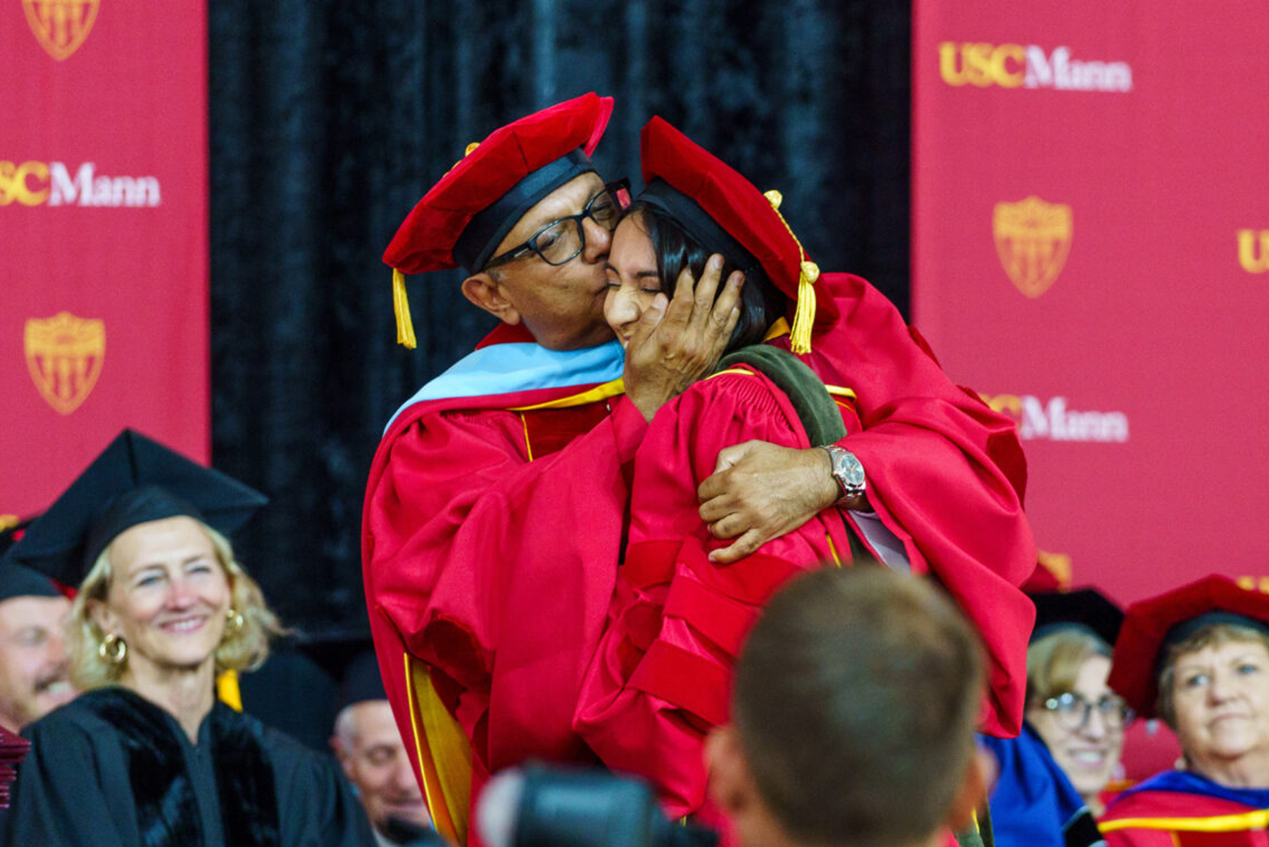 Roshni Badlani, PharmD, was hooded by her father, Anil “Neil” Badlani, a member of the USC Mann School’s Board of Councilors.