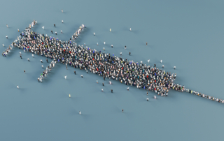 A crowd comes together to form the shape of a hypodermic needle