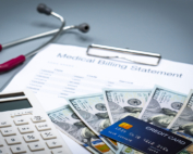 A credit card and hundreds of dollars in cash are collected for a medical bill payment