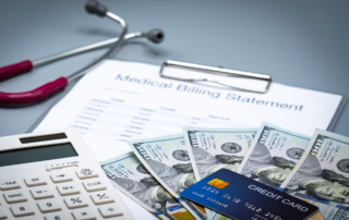 A credit card and hundreds of dollars in cash are collected for a medical bill payment