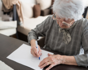An older white woman takes a test for Alzheimer's and related dementia disorders.