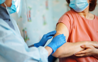 An older woman gets a shingles vaccination