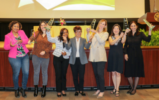 Keck School of Medicine of USC Dean Carolyn Meltzer, MD, stands proudly with the recipients of this year's faculty awards.