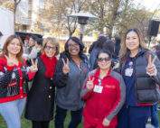 USC President Carol L. Folt with members of the Health Sciences Campus staff at the all-staff holiday reception.