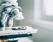 A microscope stands in a lab for pharmaceutical research