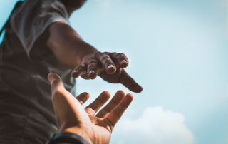 A person from the USC Chan Division offers help to someone impacted by the Southern California fires.