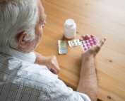 A Medicare Part D enrollee considers the cost of his prescription drugs