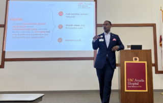 Ike Mmeje, MHSA, President and CEO of USC Arcadia Hospital, leads a town hall for hospital staff.