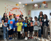 Dustin Baker, Michelle Sullivan, PT, DPT, and Shannon Bradley bring books to students of Pasadena Rosebud Academy on behalf of the Keck Medicine community