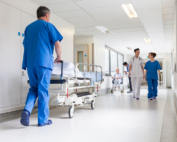 Providers from contracted medical groups work in a hospital for increased stipends